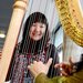 Girl smiling with harp